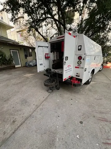 Magnet Plumbing service vehicle on-site for Grease Trap Cleaning in Anchorage
